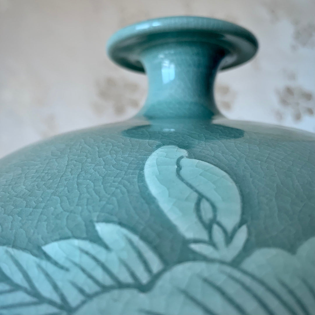 Celadon Vase with Embossed White Flower Pattern (청자 양각 화문 호)