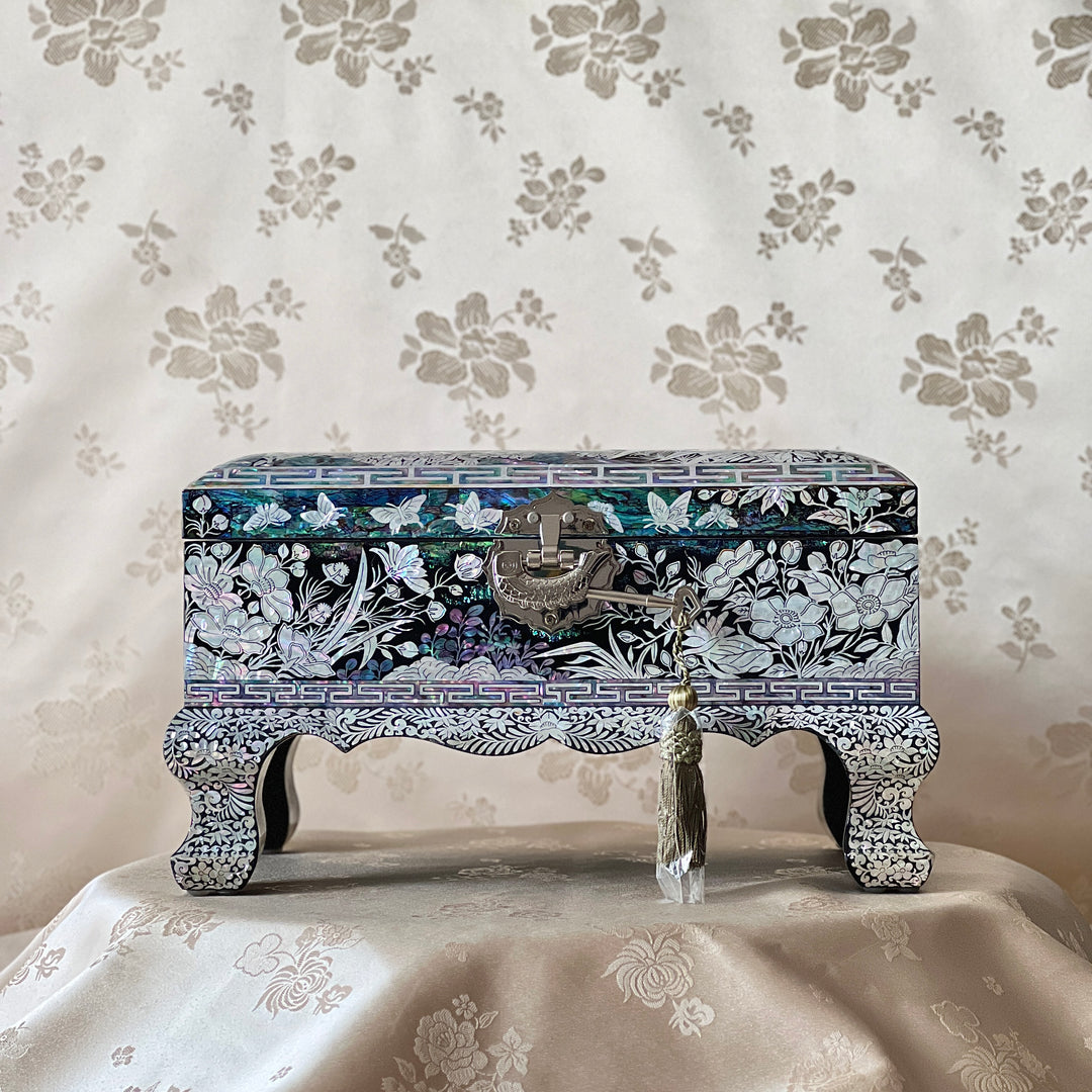 Korean mother-of-pearl legged jewelry box with mandarin ducks, butterflies, and floral inlay on black lacquer