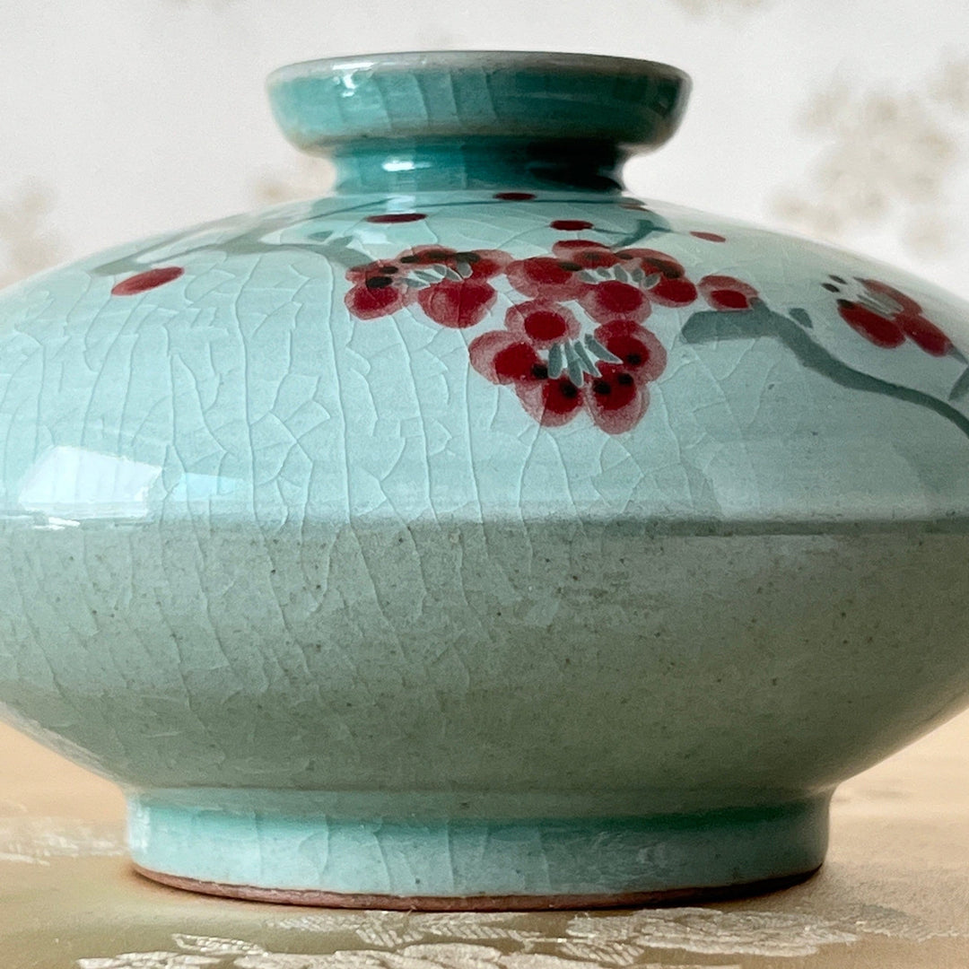 White Celadon Oil or Incense Vase with Red Plum Pattern (청자 백상감 매화문 유병)