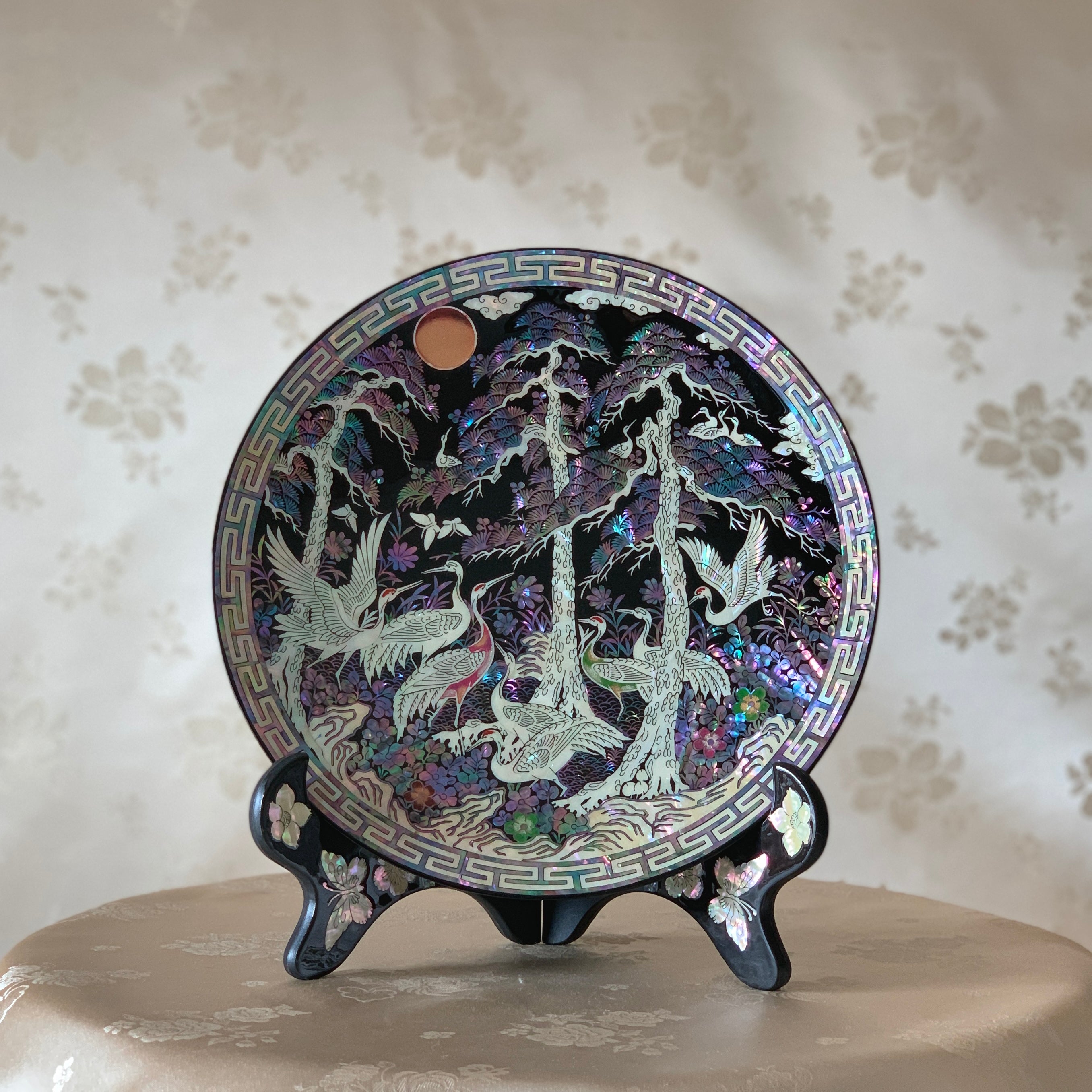 Handcrafted 자개 송학문 접시: A masterpiece of Korean art featuring natural mother of pearl and lacquer, showcasing the ancient najeon chilgi technique.
