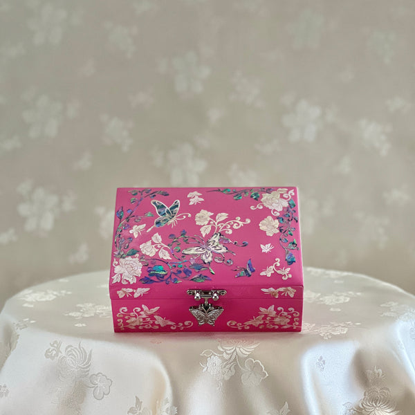 Small pink mother-of-pearl jewelry box with butterfly and peony inlay