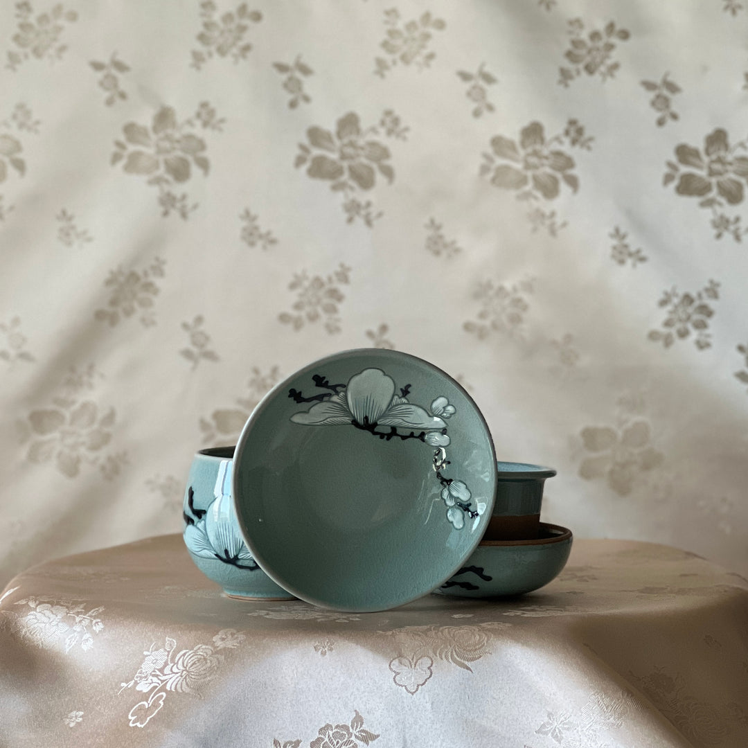 Celadon Tea Cup: Embossed Magnolia Motif