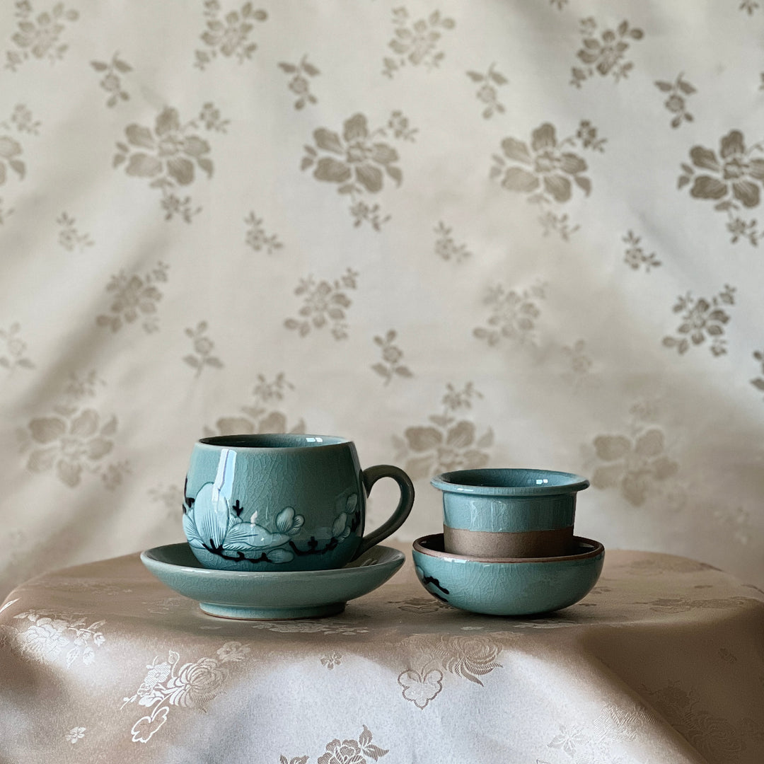 Celadon Tea Cup: Embossed Magnolia Motif