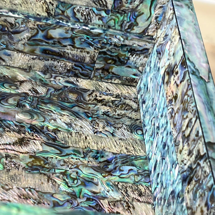 Close-up of abalone-shell ground with iridescent mother-of-pearl texture on a Korean jewelry box