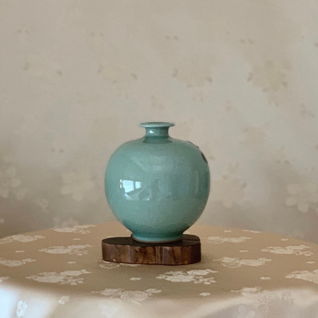 Celadon Vase with Embossed Plum Tree Pattern (청자 양각 매화문 호)