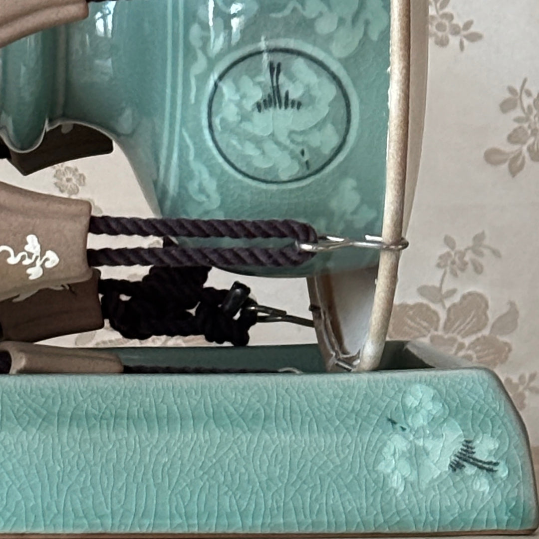 Close-up of a celadon handmade janggu with cranes pattern