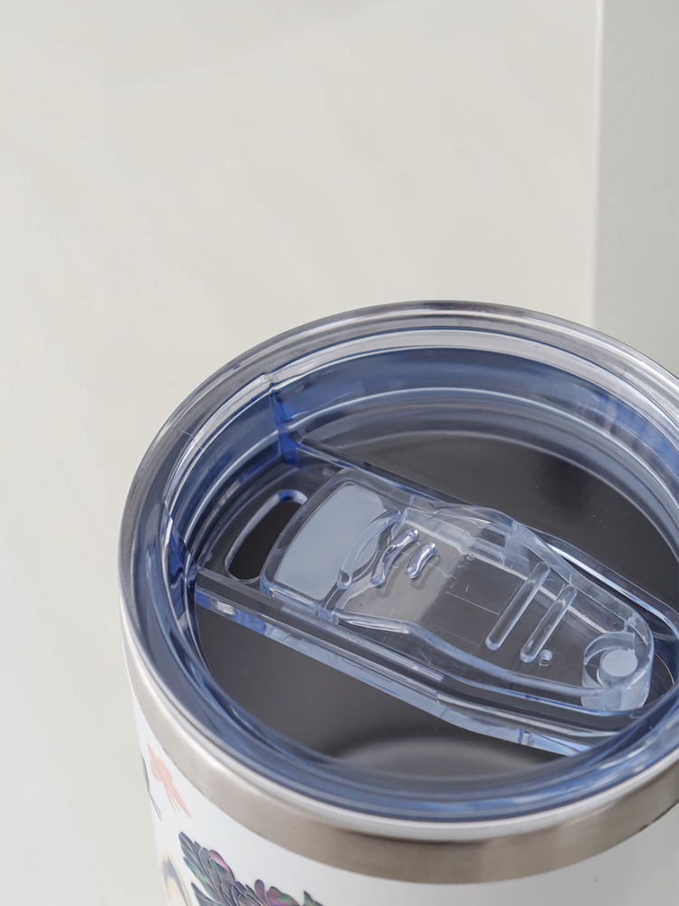 Overhead view of the clear sliding lid on the mug, showing the slide-open drink opening