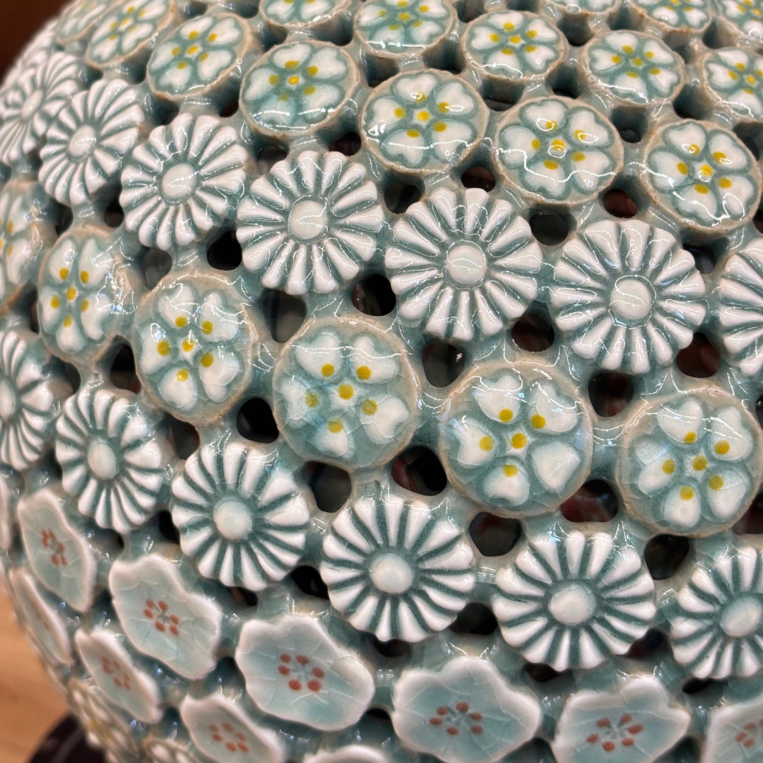 Close-up of a ceramic pot with floral patterns