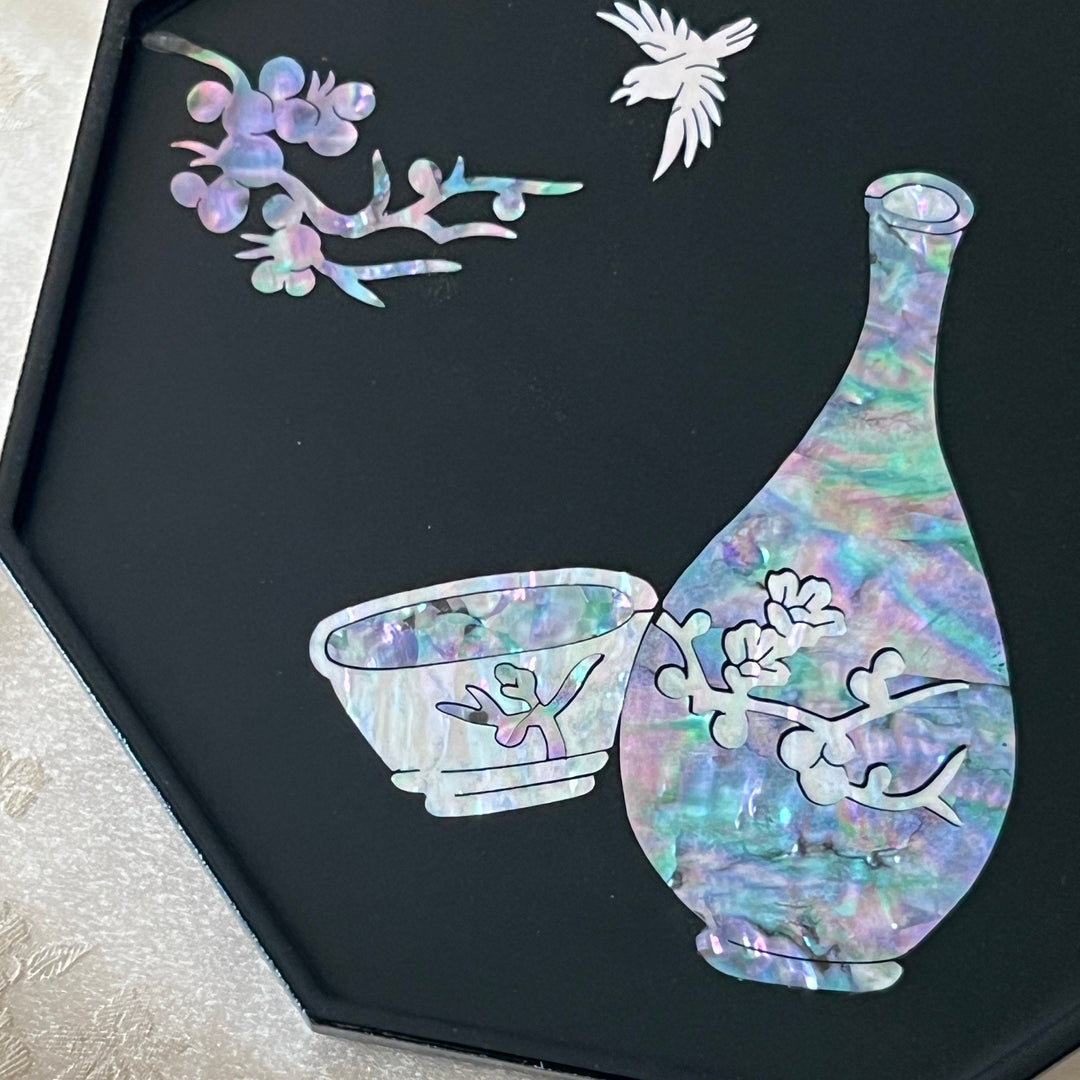 Korean mother of pearl lacquer tray displayed upright on ivory silk background