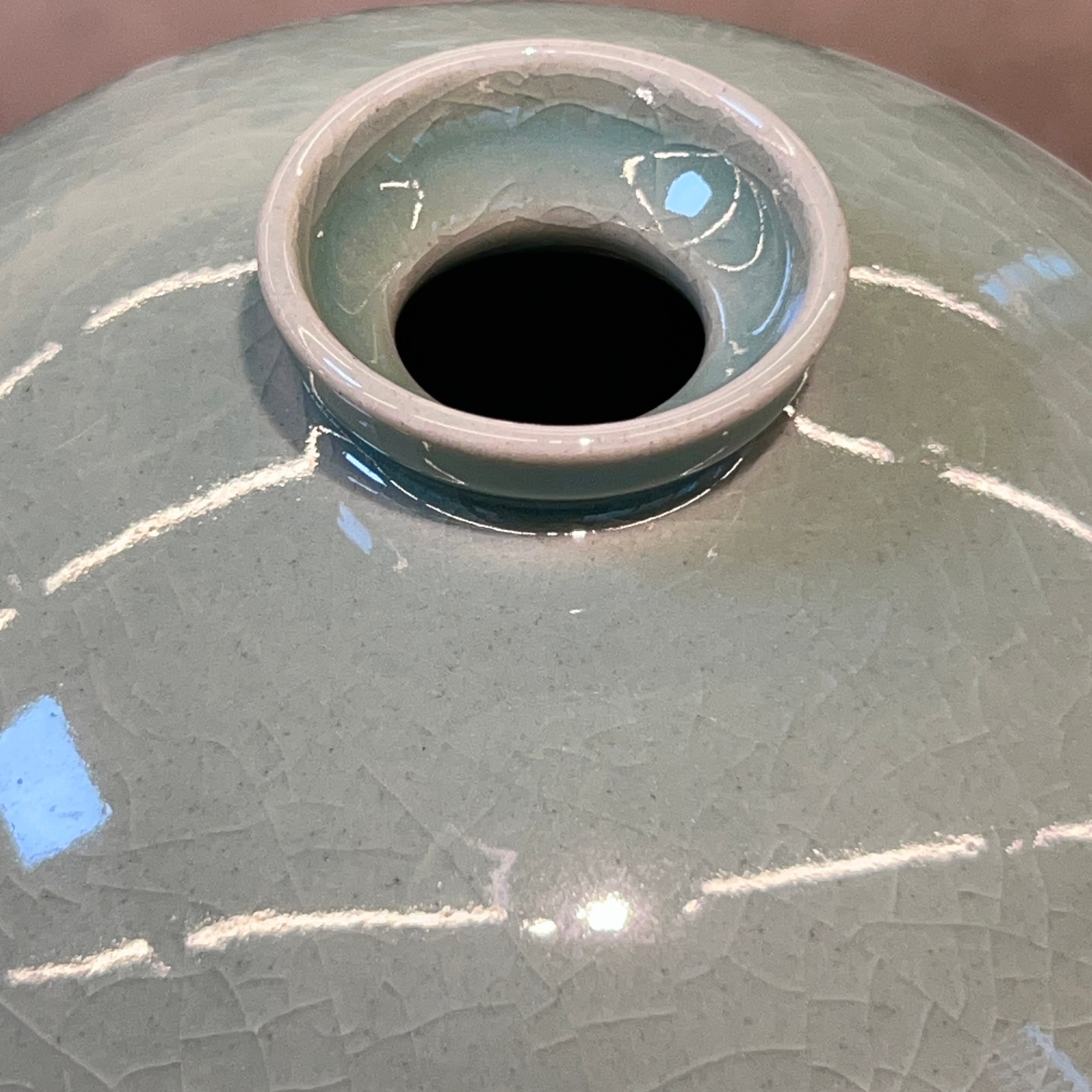 Close-up of a ceramic vase opening