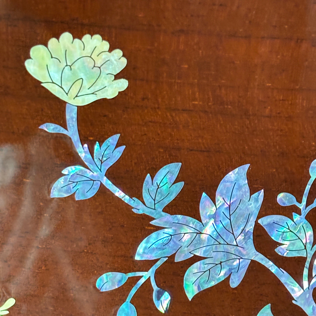 Decorative floral design on a wooden surface