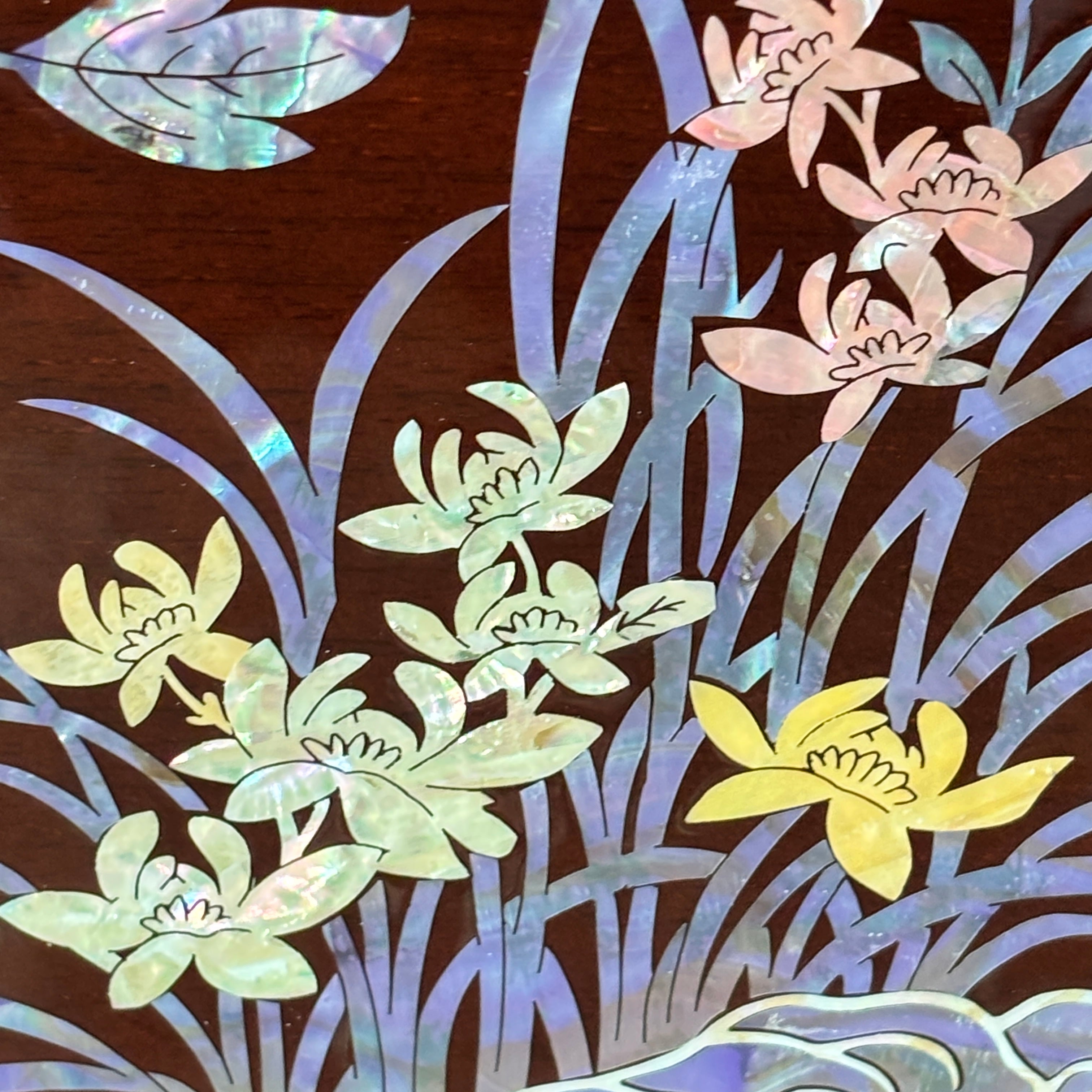 Decorative design of flowers and leaves on a brown background