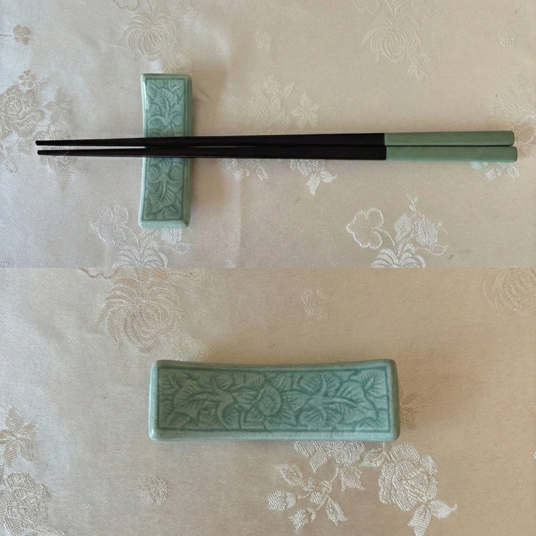 Green ceramic chopstick rest with floral patterns