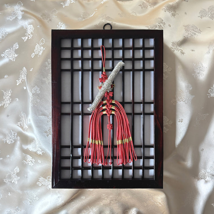 A traditional Korean Norigae with Jangdo Ornament and Nakjibal Knot with knife