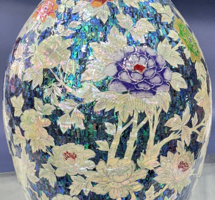 Decorative vase with floral patterns on a purple background