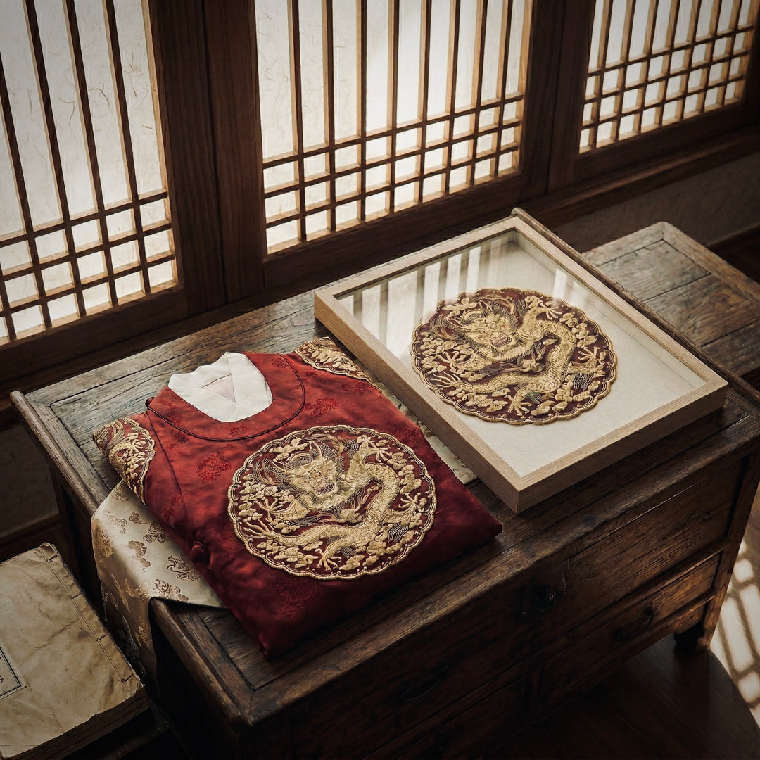 Traditional embroidered items on a wooden table with a window in the background