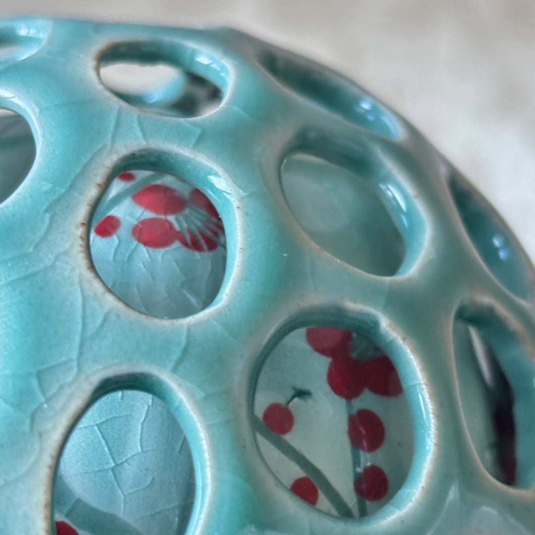 Ceramic dish with floral patterns on a light blue background