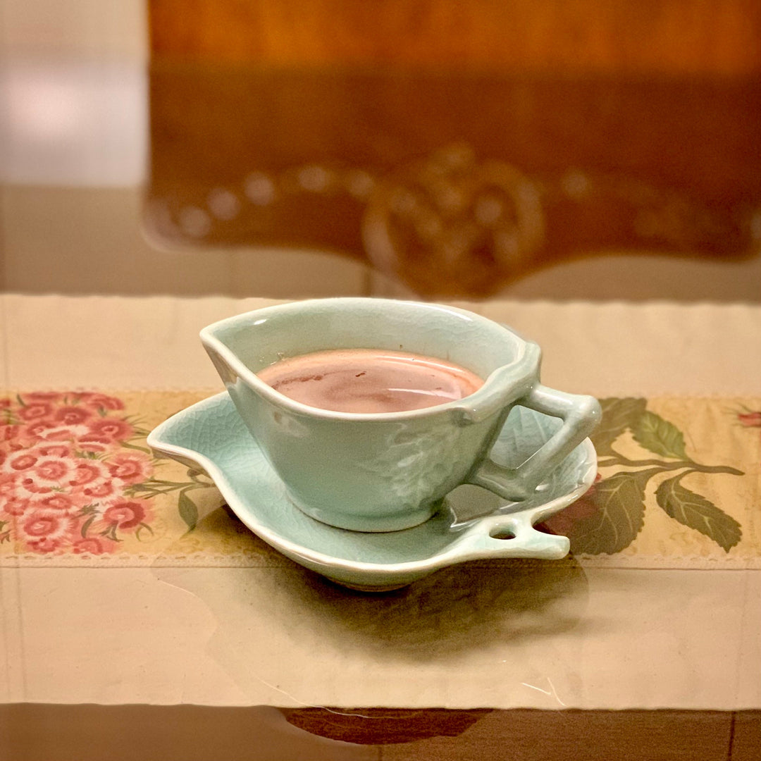 Handmade Korean celadon tea cups shaped like peaches, a symbol of longevity, with leaf-shaped saucers. A meaningful gift for couples. Ships from Korea.