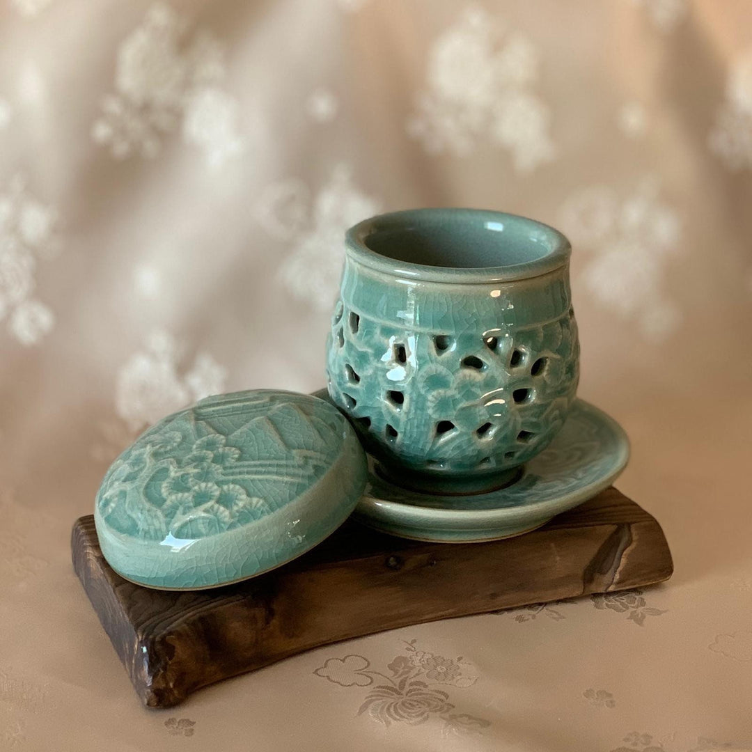 Celadon Double Wall Openwork Tea Cup with Ten Longevity Symbols Pattern Including Infuser and Plate (청자 양각 이중투각 십장생문 찻잔)